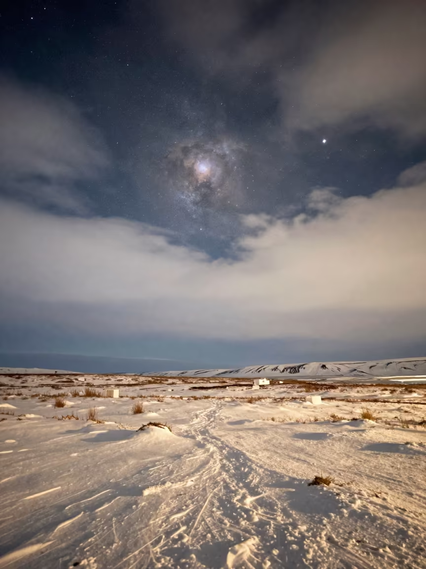 Orion Nebula Above Snowy Prairie Near Reykjavik in across a wide valley floor near Reykjavik