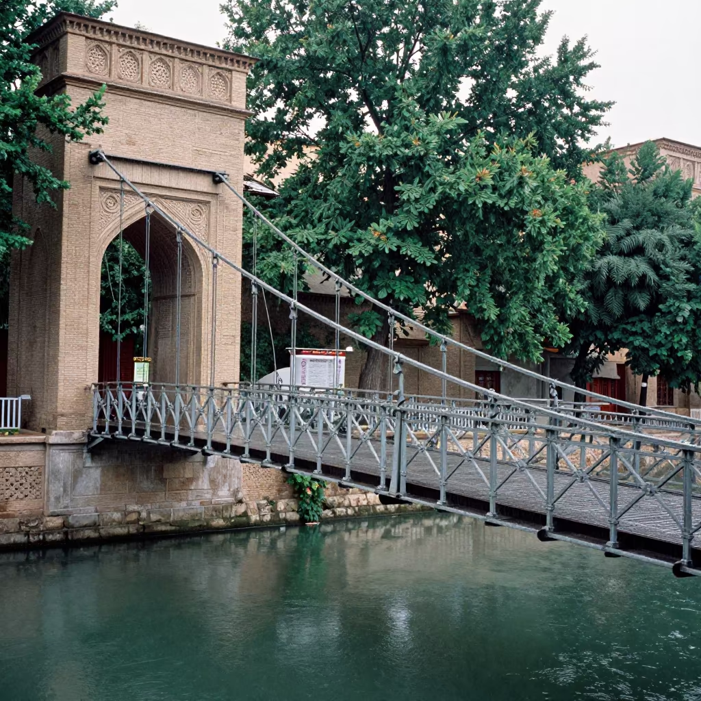 Ornate Iron Bridge Tilted Over Tabriz Canal in beside a canal-front facade in Tabriz
