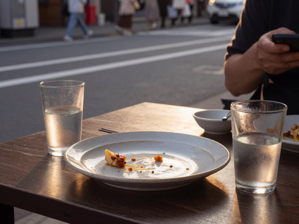 Osaka Japan Golden Hour Street Scene with Ceramic Plate and Glass Tumblers in in Osaka, Japan