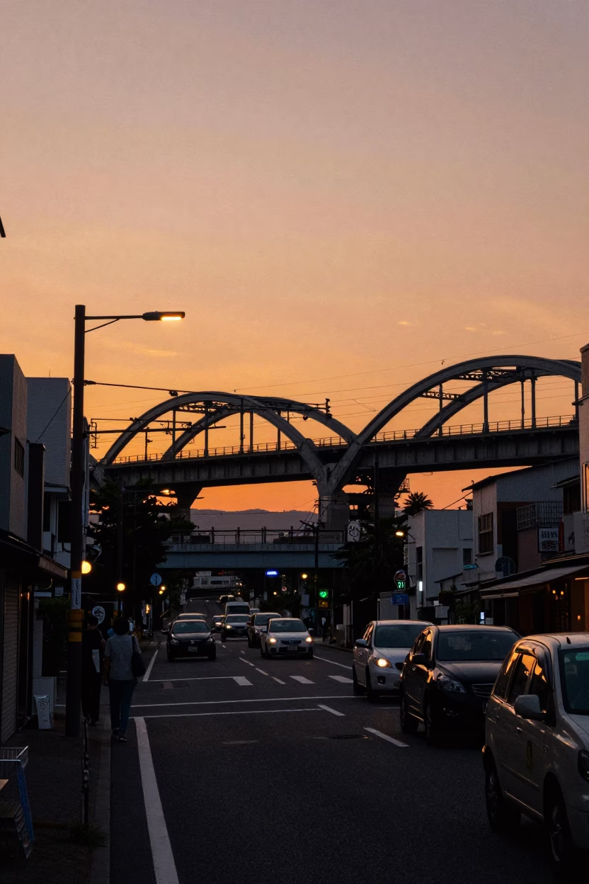 Osaka Japan Sunset Street Scene with Railway Viaduct and Passing Train in in Osaka, Japan