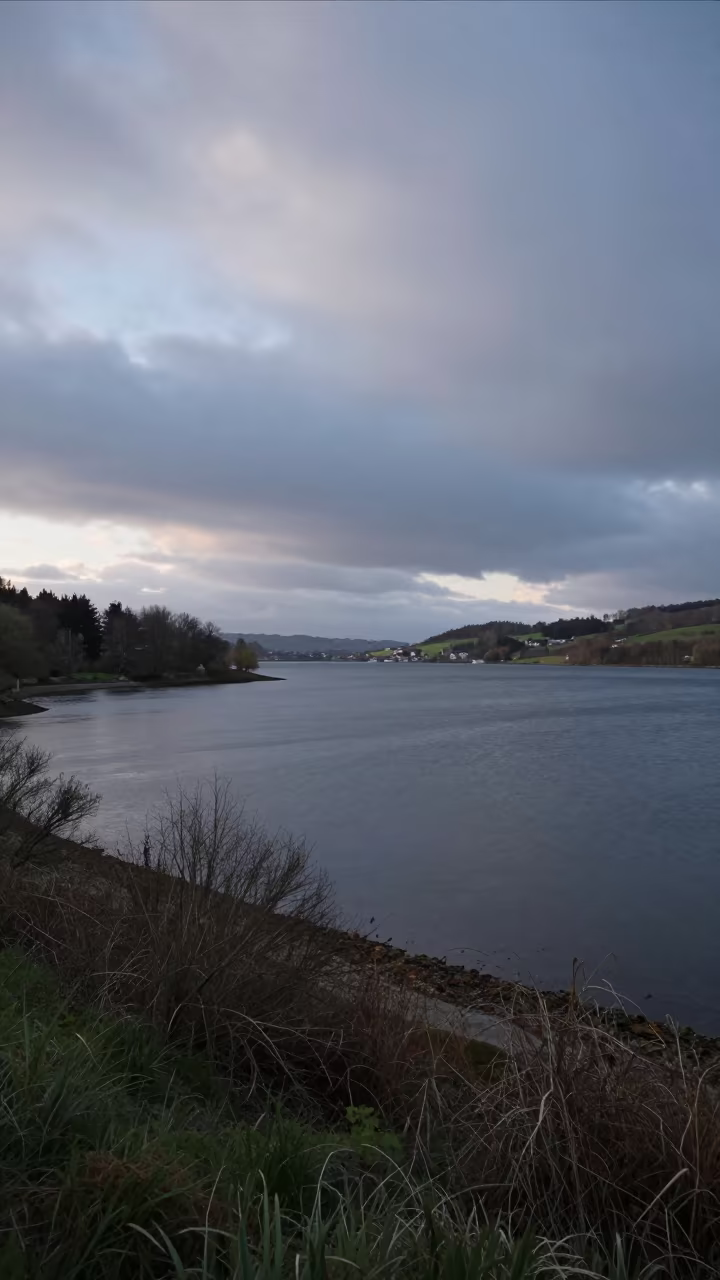 Overcast Sky Pressing on Grey Lake Galicia in beneath fast-moving cloud bands in Galicia