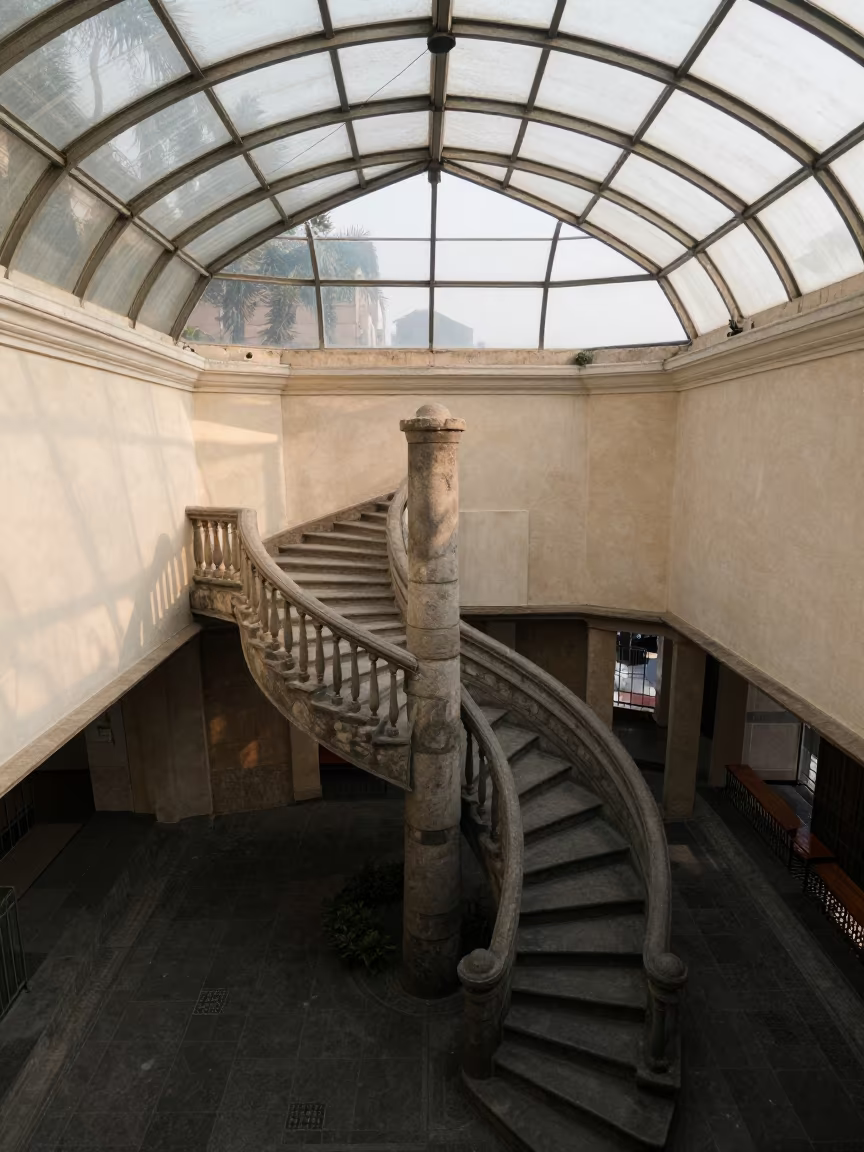 Overhead Spiral Staircase in Glass Arcade Rimac in inside a glass-roofed arcade in Rimac, Lima