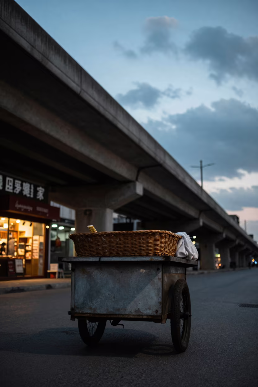 Overpass Shadow Falls on Aydın Street Vendor Cart in along a market-lined side street in Aydın