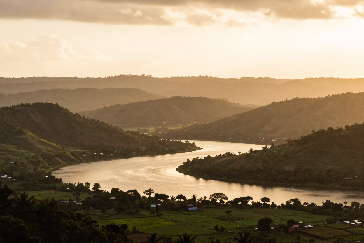 Oxbow Lake Silhouette Haiti Golden Hour in from a ridge above layered foothills in Haiti