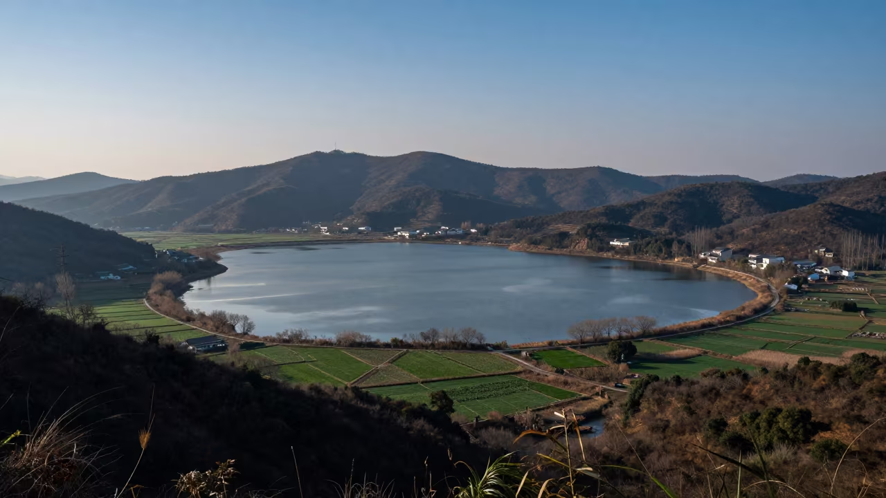 Oxbow Lake Under Starlight Before Dawn in from a ridge above layered foothills near Suzhou
