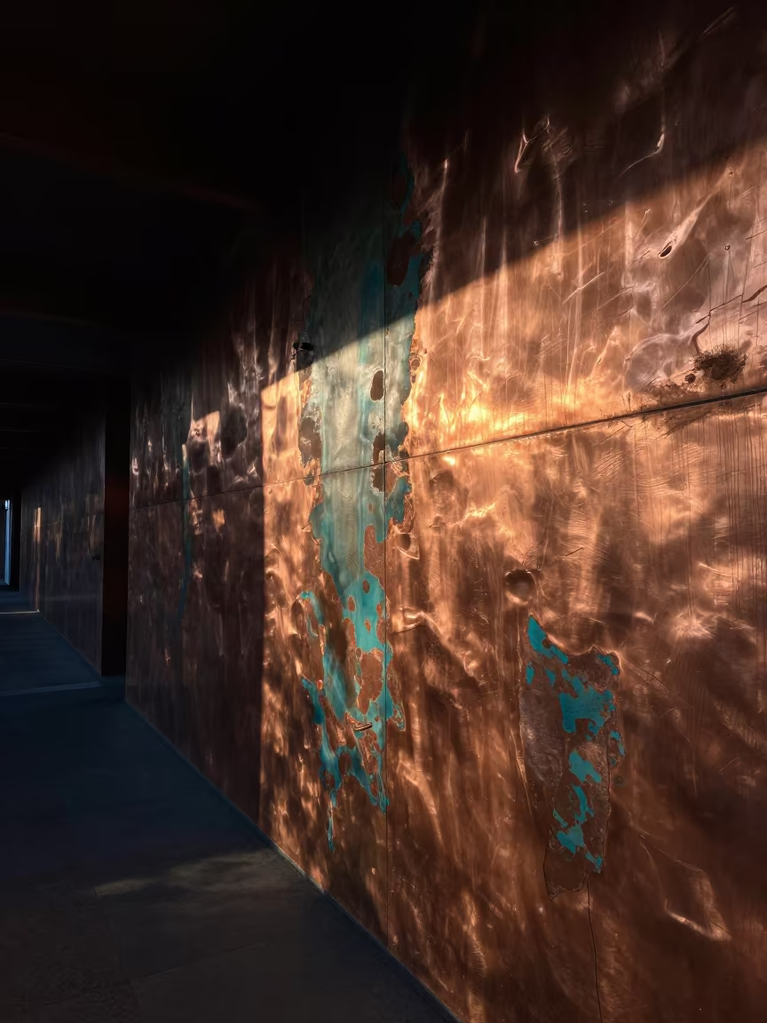 Oxidized Copper Color Study in Predawn Firelight in inside a skylit passageway near Dalston, London