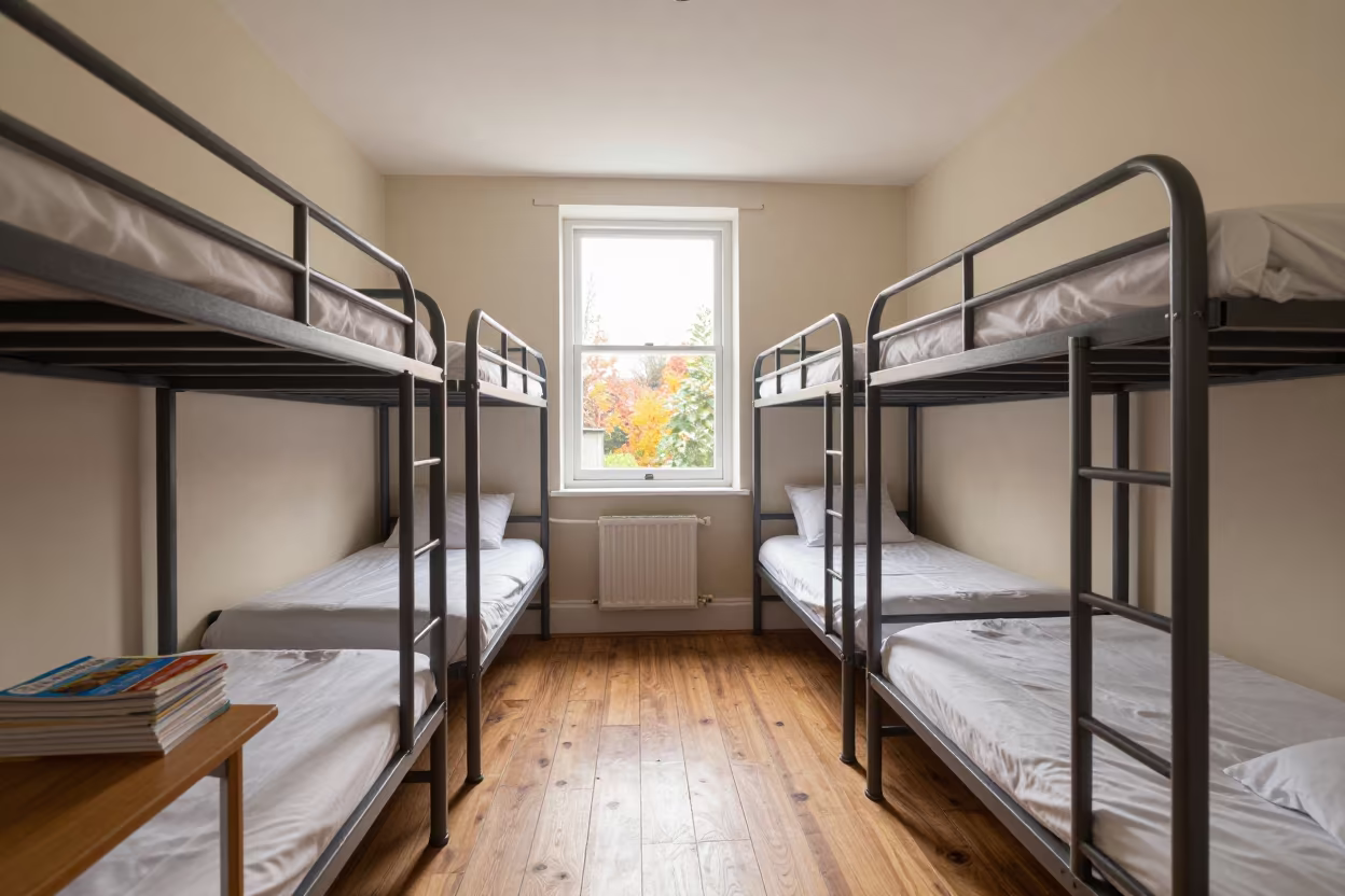Pale Dawn Light in Autumn Hostel Bunk Room in in a quiet guest corridor near Gloucester