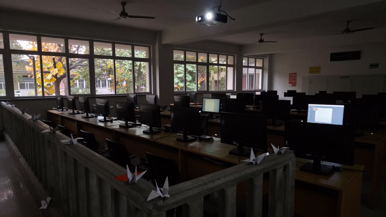 Paper Cranes on School Staircase in Projector Glow in in a computer lab before lessons near Sukkur