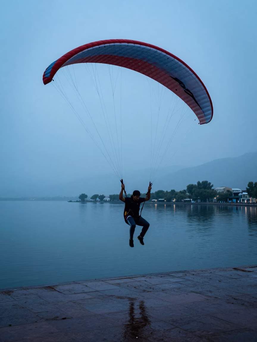 Paraglider Stall Over Calm Lake at Twilight in at a harbor quay near Tashkent