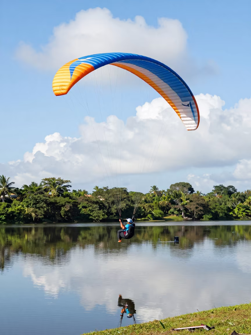 Paraglider Stalled Over Calm Lake Lake in by a riverbank near Fort-de-France