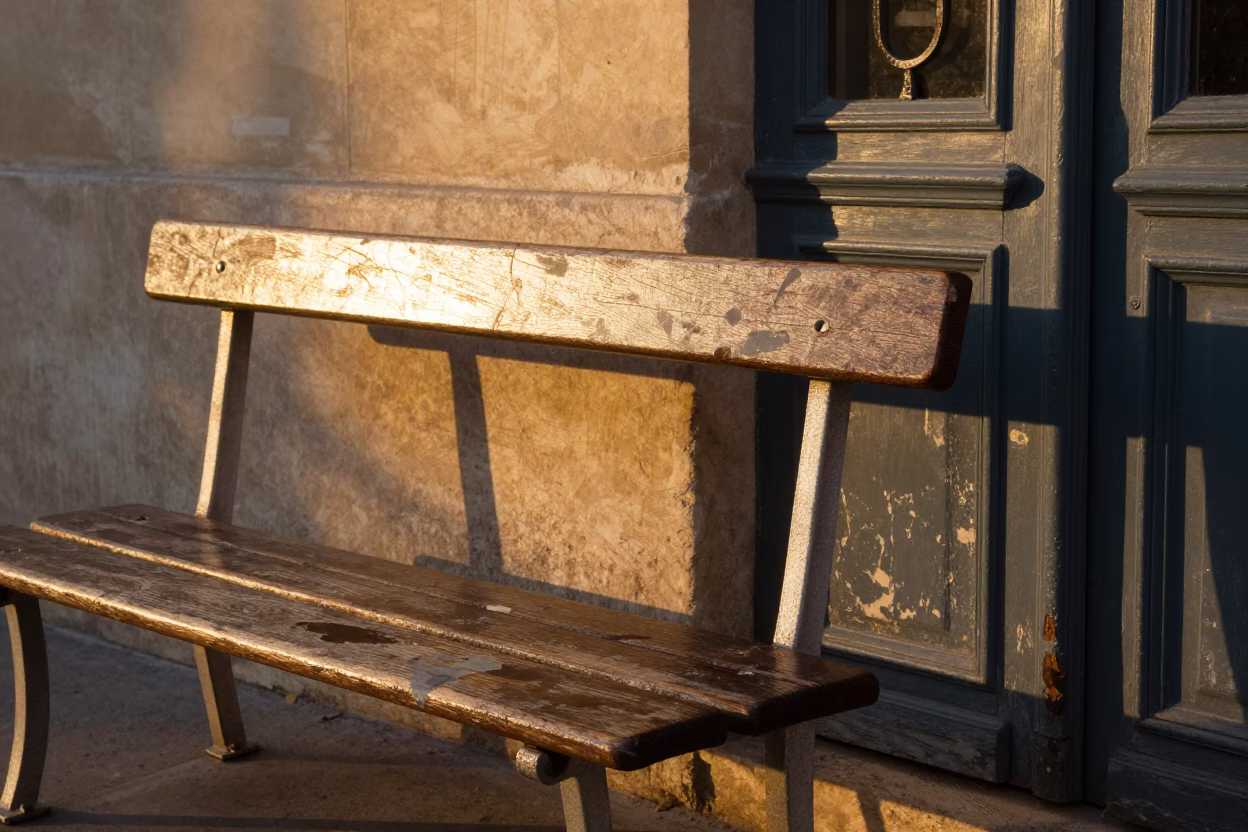 Parisian Street Bench at Golden Hour with Smudges and Doorframe Details in in Paris, France