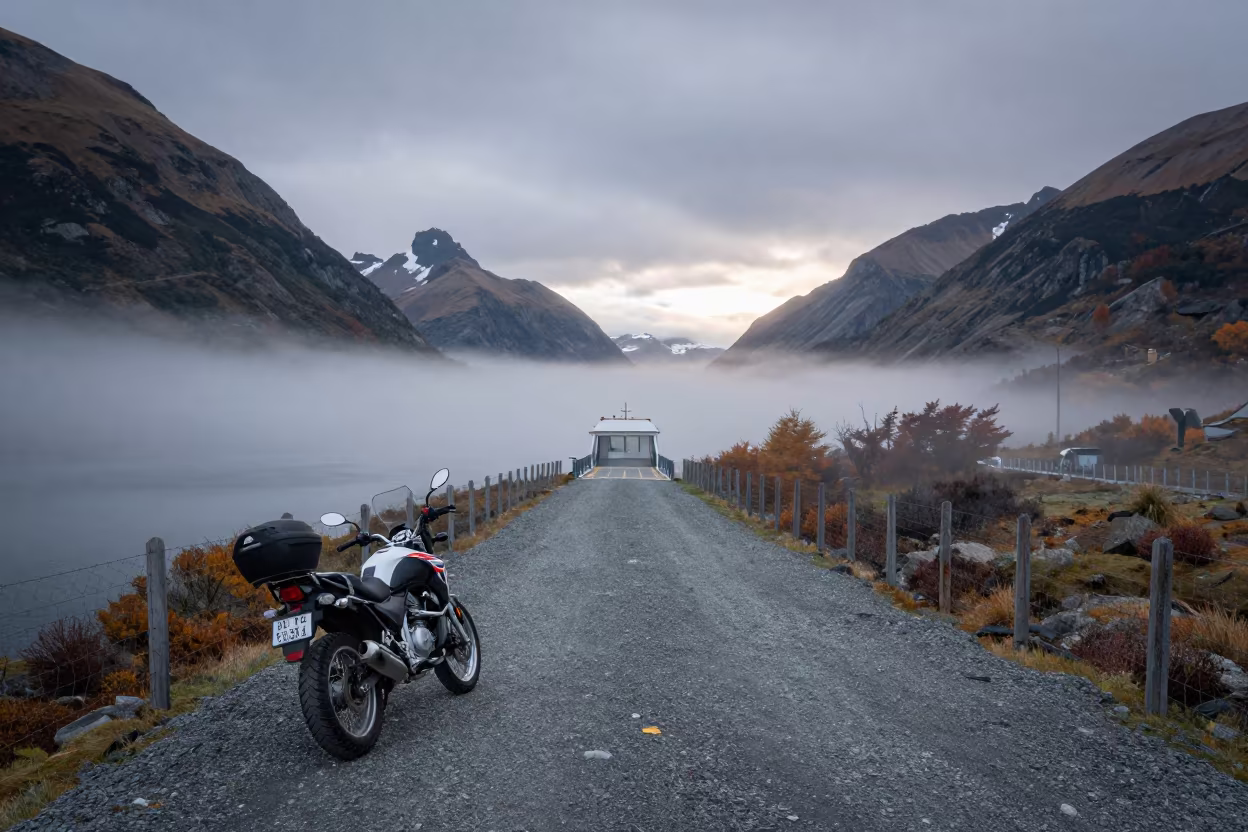 Patagonian Motorcycle at Misty Dawn Overlook in across a remote ferry crossing in Patagonia