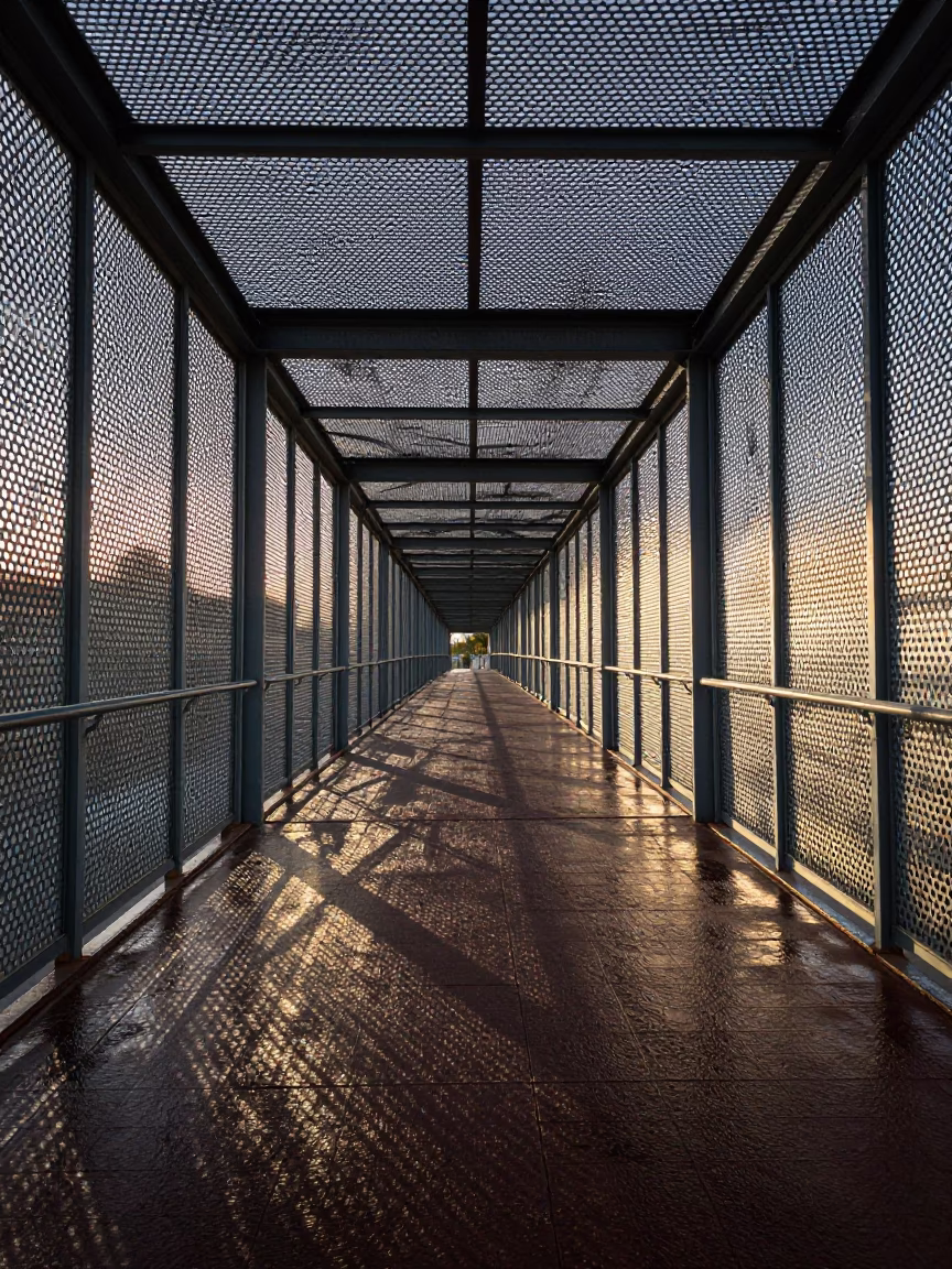 Pedestrian Overpass of Perforated Metal and Wet Footsteps in Seville at Nautical Dawn in in Seville, Spain