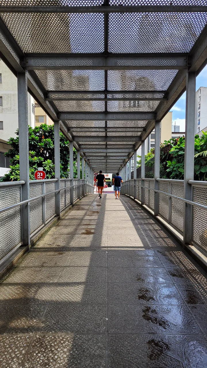 Pedestrian Overpass Perforated Metal and Wet Footsteps in Bright Midmorning São Paulo Brazil in in São Paulo, Brazil