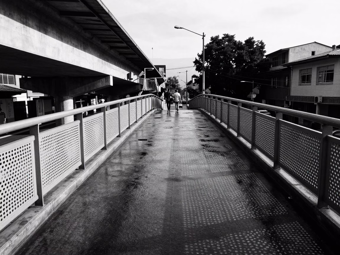 Pedestrian Overpass Perforated Metal and Wet Footsteps in Medellin Colombia Afternoon in in Medellin, Colombia