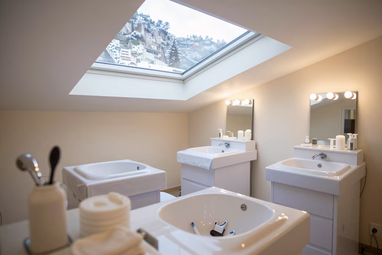 Pedicure station with basins under winter light in at a barber station beneath mirror bulbs near Amalfi