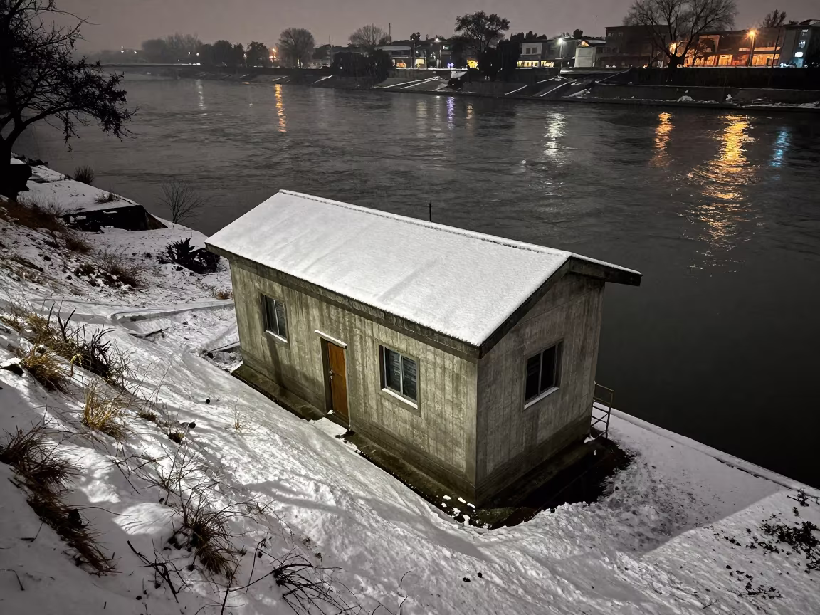Penstock Valve House on Snowy Slope Delhi in along concrete walls above turbulent water in Mehrauli, Delhi