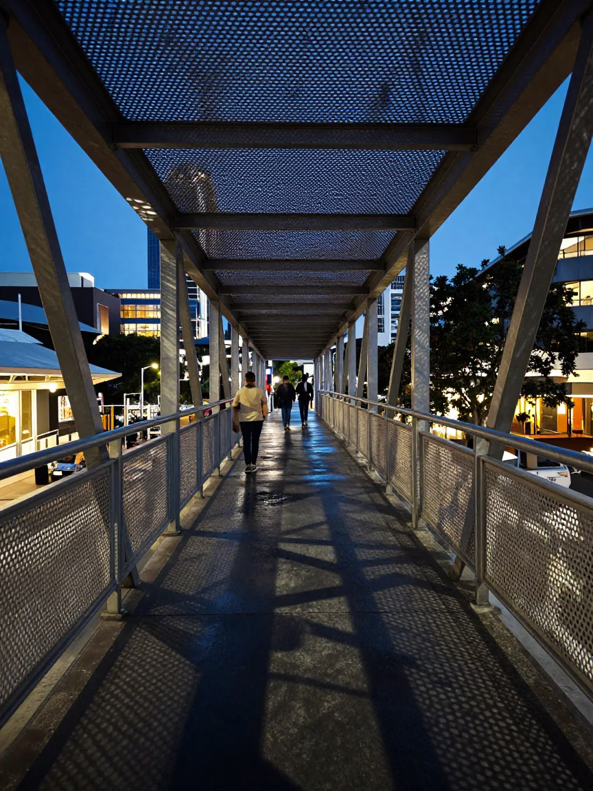 Perth Evening Pedestrian Overpass Perforated Metal and Wet Footsteps in Blue Light in in Perth, Western Australia, Australia