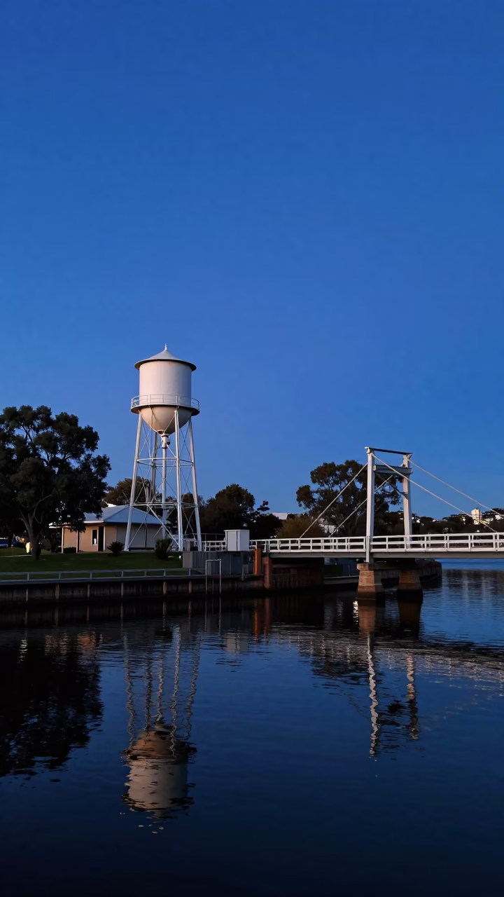 Perth Riverbank at Blue Hour with Water Tower and Drawbridge Reflections in in Perth, Western Australia, Australia