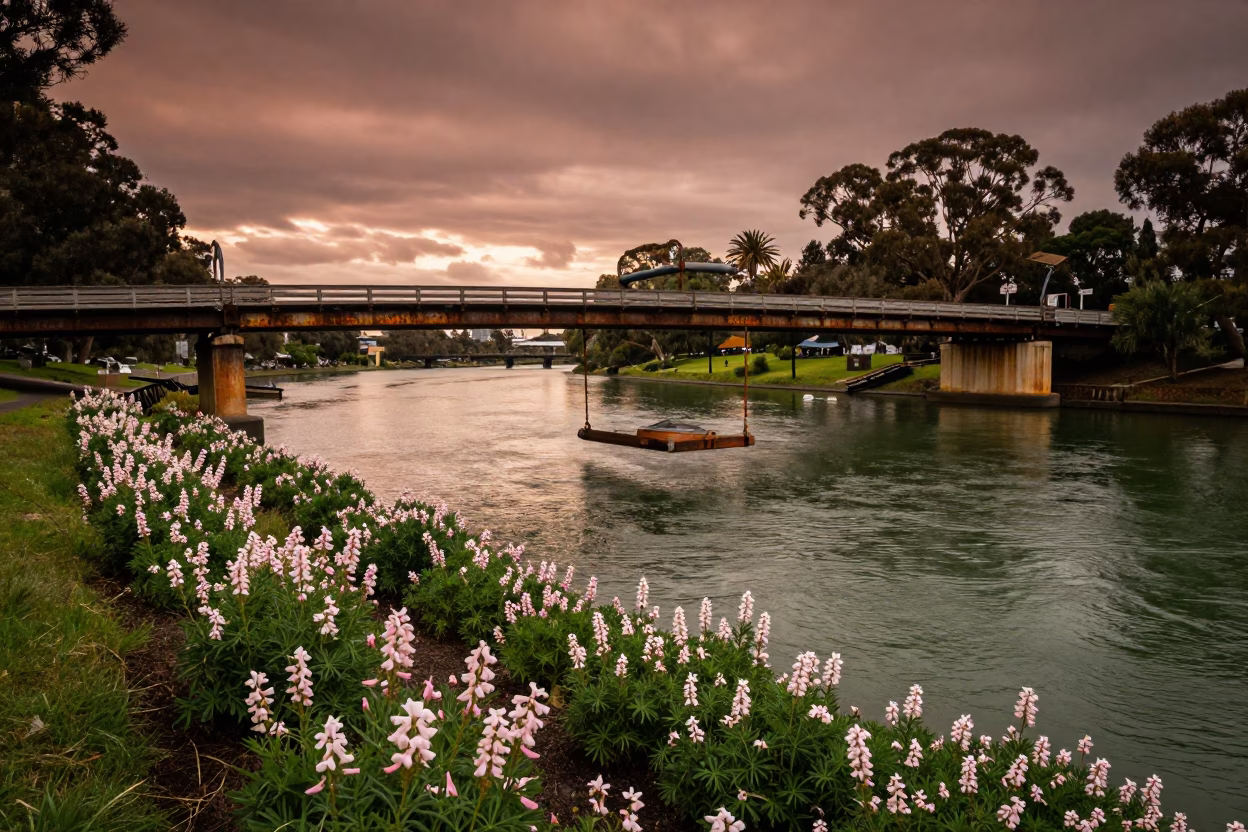 Perth Riverbank at Dusk with Sweet Peas and Bridge Maintenance Cradle in Copper Light in in Perth, Western Australia, Australia