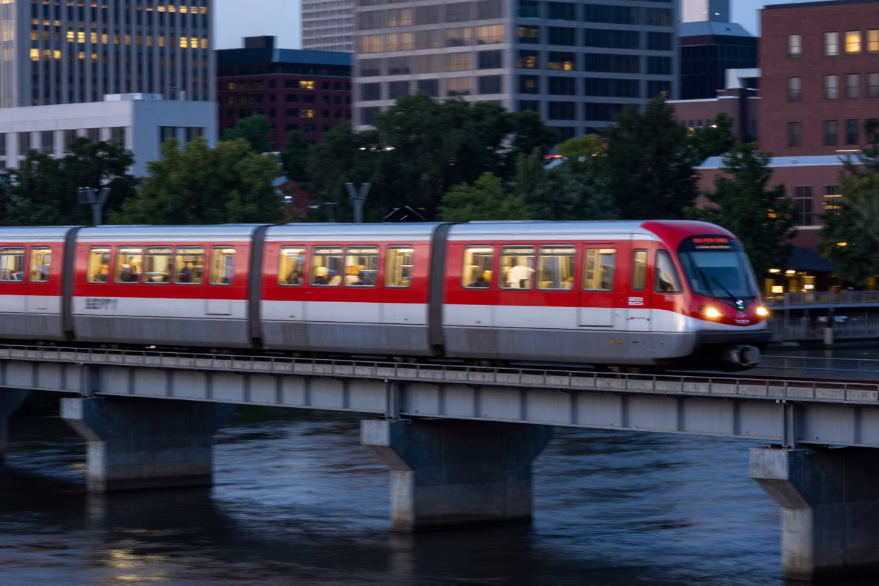 Philadelphia SEPTA Red Arrow Monorail Sweeping Over Schuylkill River at Twilight Blue Hour in in Philadelphia, Pennsylvania, United States
