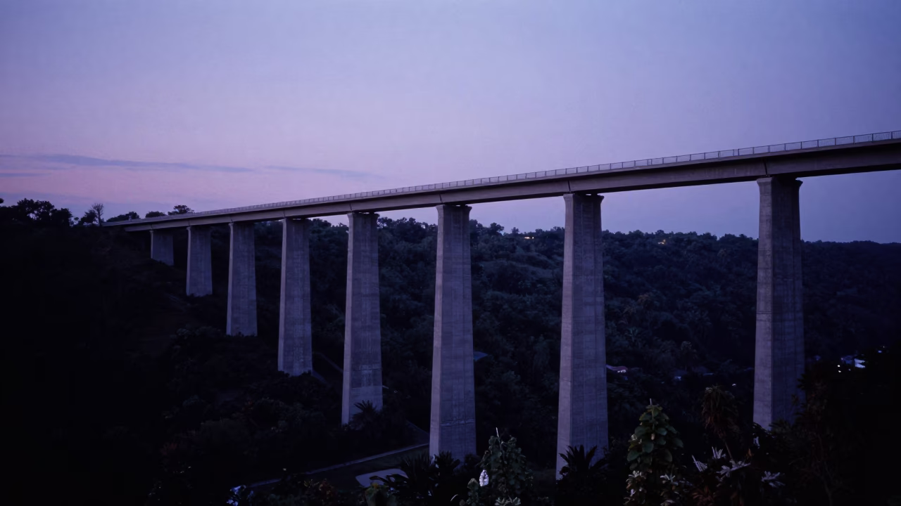 Philadelphia Twilight Concrete Viaduct Curving Across Valley Floor with Urban Skyline in in Philadelphia, Pennsylvania, United States