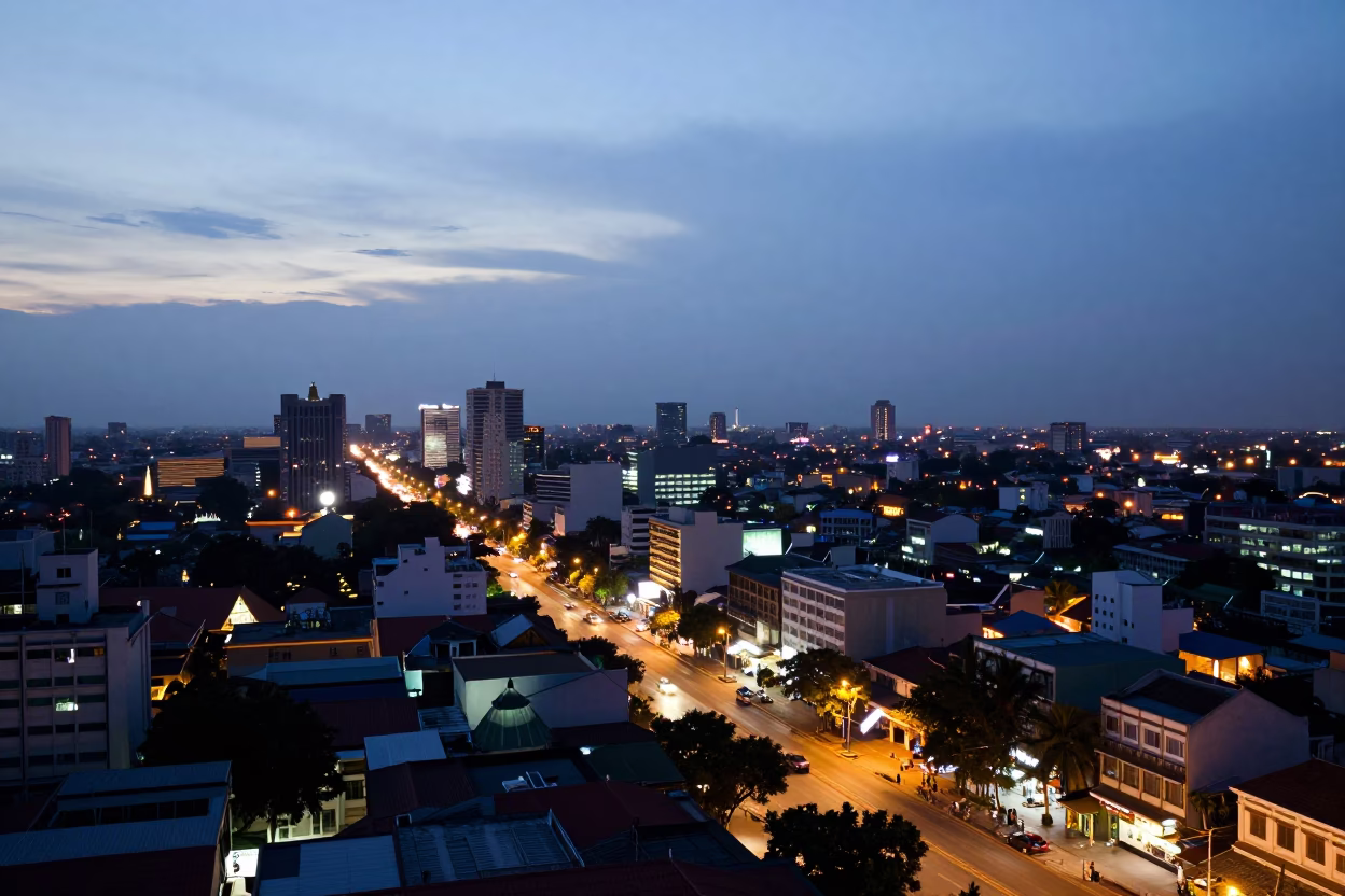 Phnom Penh Cambodia dusk cityscape view from rooftop with street life below in in Phnom Penh, Cambodia