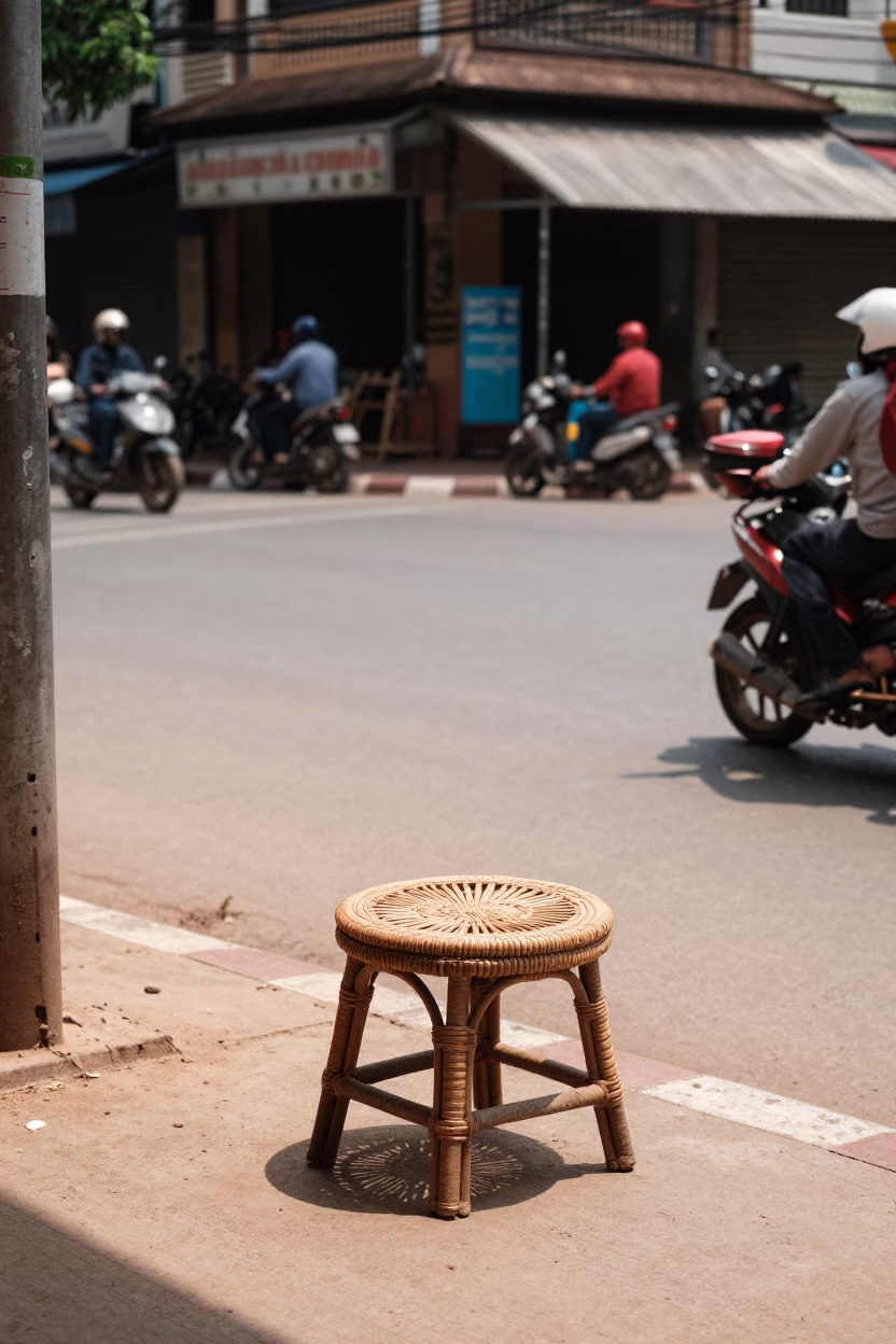 Phnom Penh Noon Street Scene with Rattan Stool and Local Market Activity in in Phnom Penh, Cambodia
