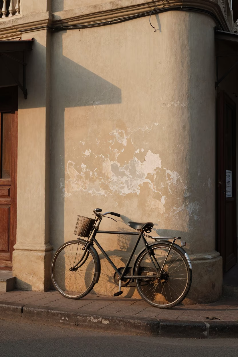 Phnom Penh Street Scene Early Afternoon Vintage Bicycle Against Wall in in Phnom Penh, Cambodia