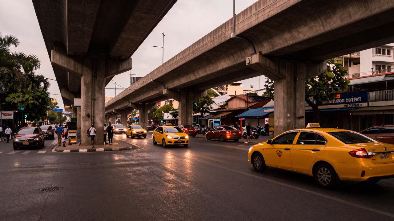 Phnom Penh Street Scene Under Flyover with Yellow Taxi and Condensed Milk Dessert in in Phnom Penh, Cambodia