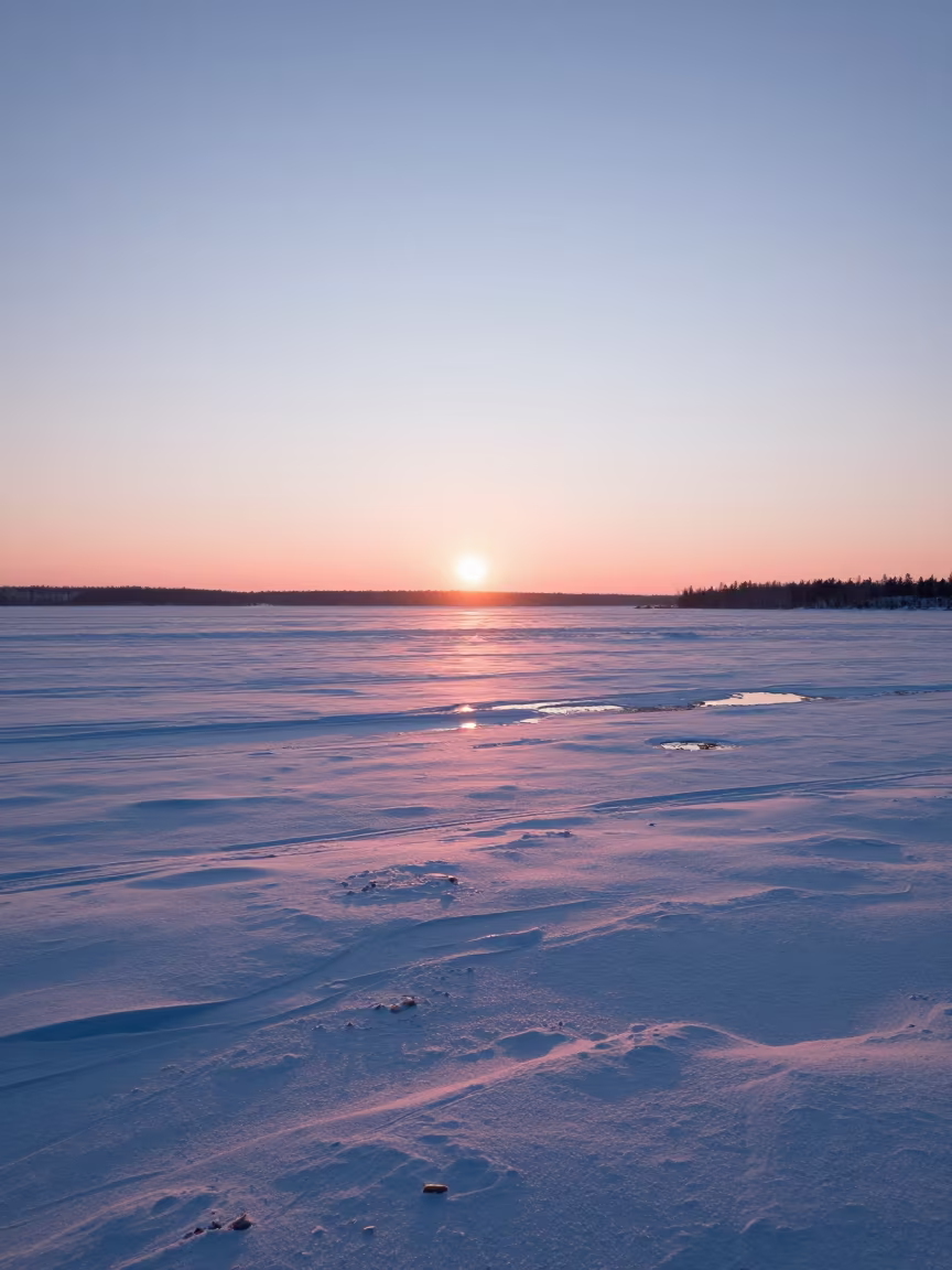 Pink Dawn Light Over Canadian Snow Fields in across a floodplain after rain in Canada