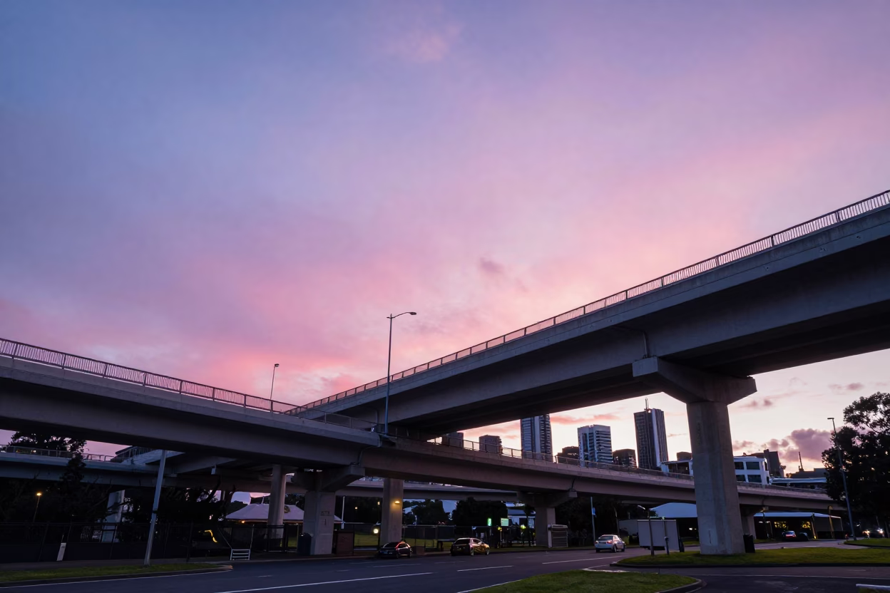 Pink Evening Sky Over Auckland Highway Flyover Stack and Coastal Weather Radar Installation in in Auckland, New Zealand
