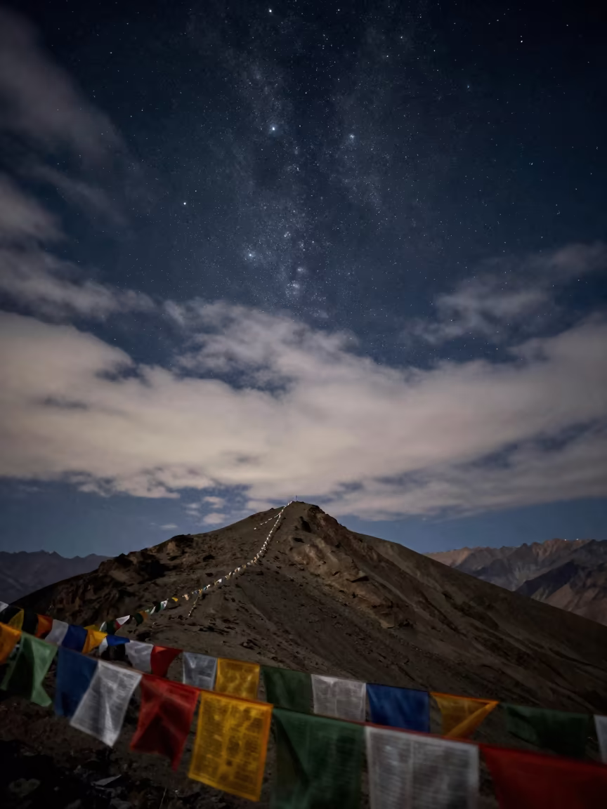 Pleiades Through Cirrus Clouds Leh Ridge in on a wind-cut ridge below prayer flag lines near Leh