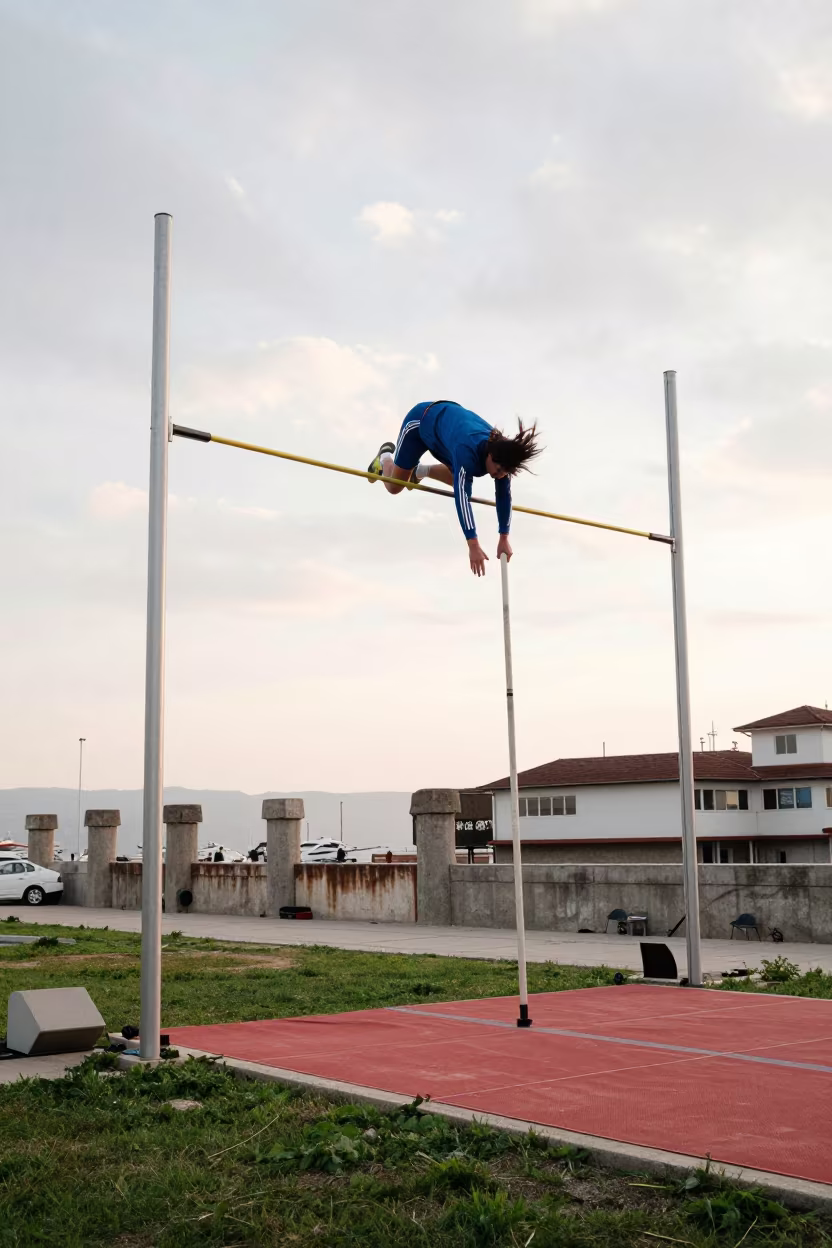 Pole Vaulter Clears Bar at Durrës Harbor in at a harbor quay near Durrës