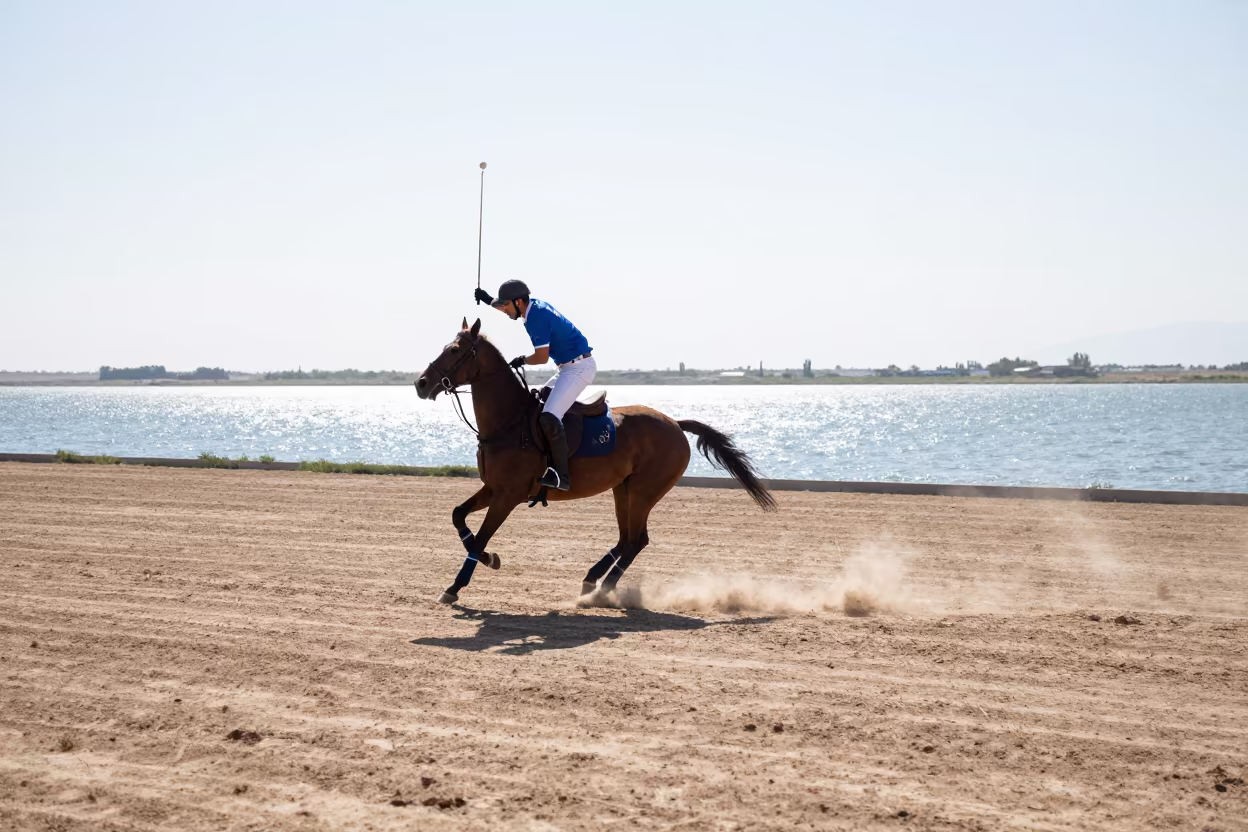 Polo Rider Leaning Backhand at Riverside Landing in near a riverside landing in Denizli