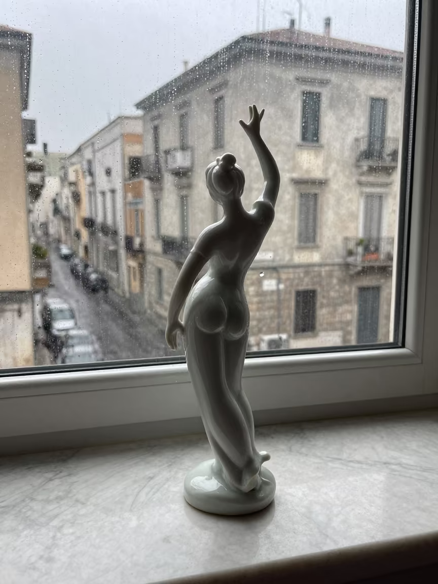 Porcelain Dancer on Marble Mantel in Rainy Bari in in Bari