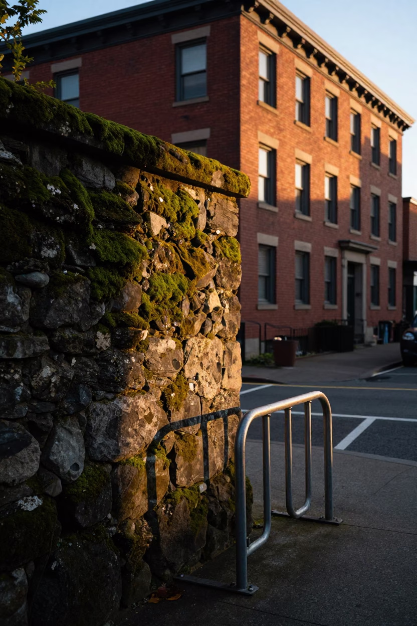 Portland Oregon Sunset Street Scene with Mossy Stone Wall and Vintage Bicycle Rack in in Portland, Oregon, United States