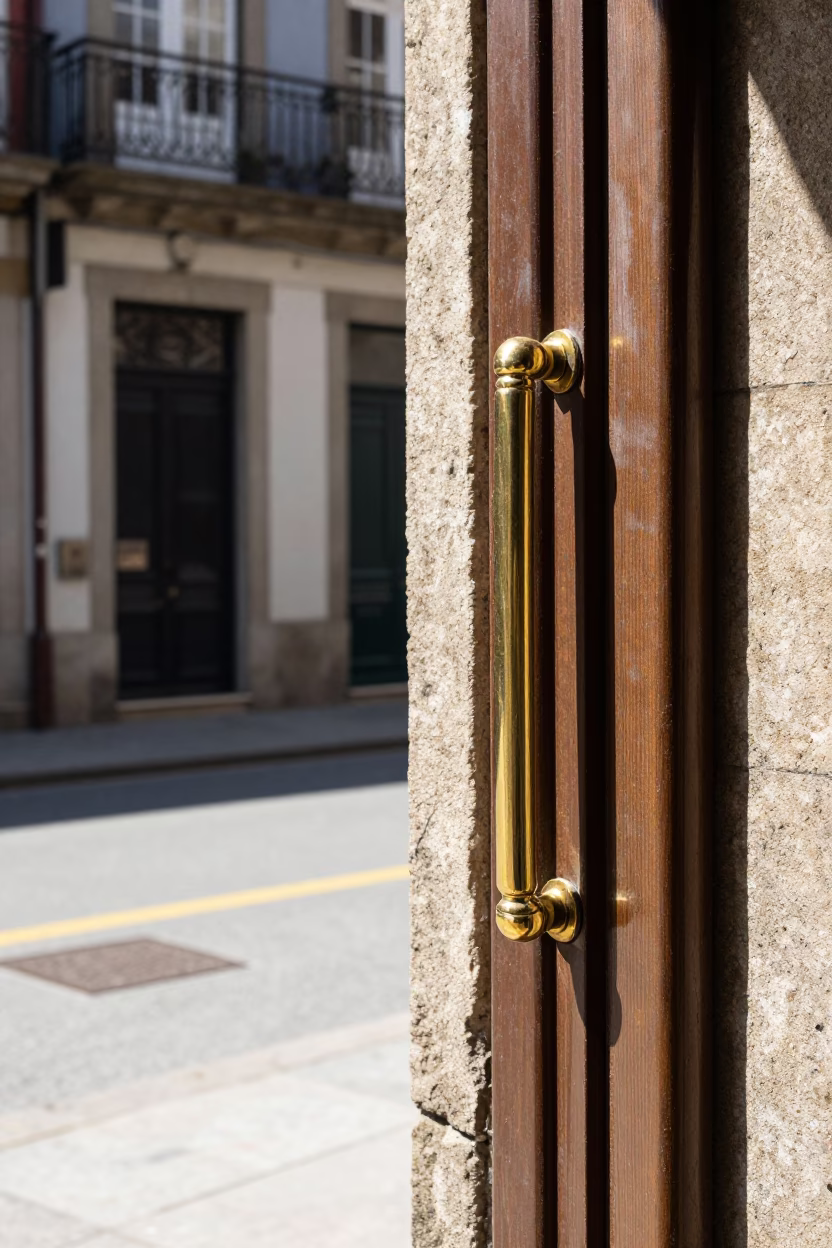 Porto Portugal Midday Street Scene with Polished Brass Handle and University Arcade in in Porto, Portugal