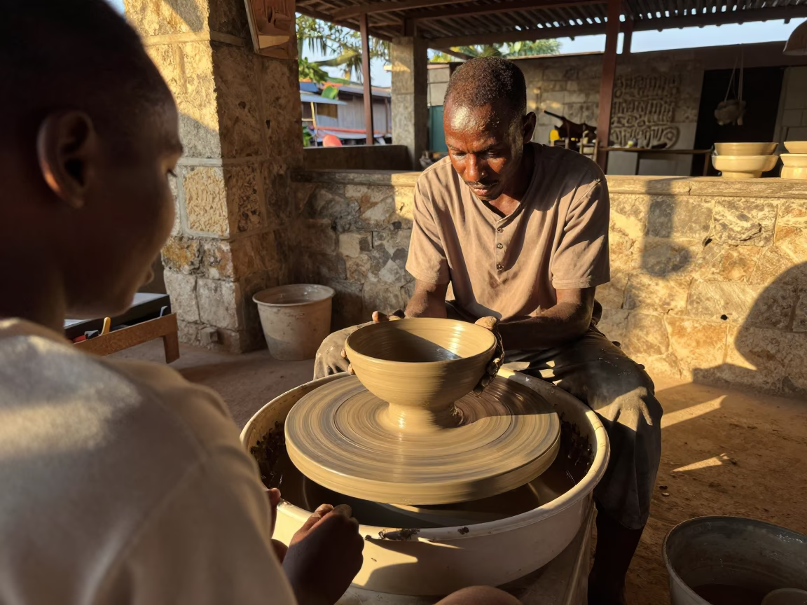 Potter Shapes Clay Bowl in Zanzibar Market Hall in in a market hall in Zanzibar