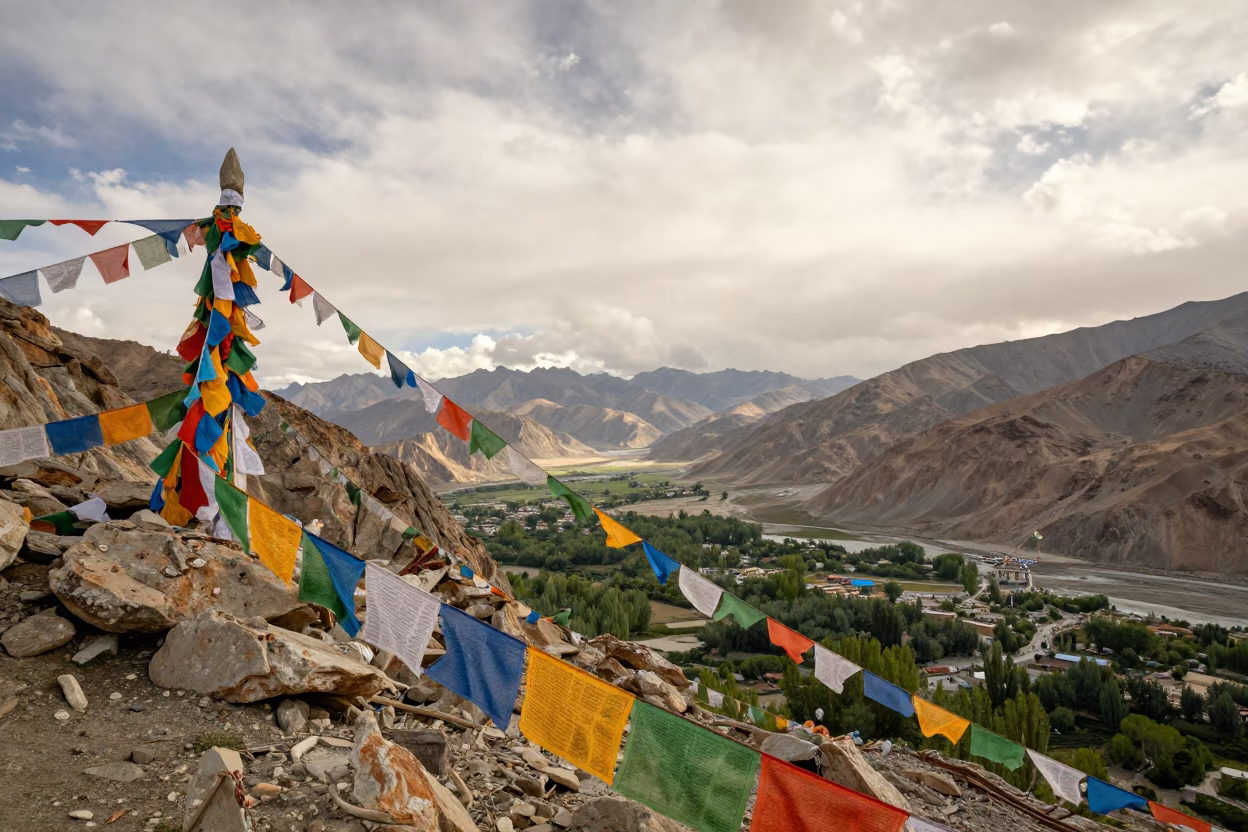 Prayer Flags Fluttering Over Mountain Valley Saddle Leh in at a rocky saddle overlooking a mountain valley near Leh