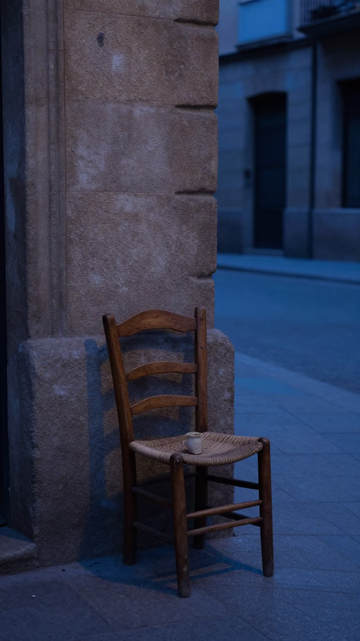Pre-dawn Barcelona Street Scene with Ladder-Back Chair and Stoneware Crocks in in Barcelona, Spain