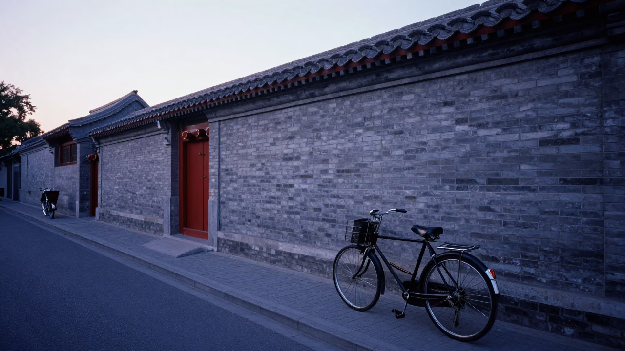 Pre-dawn Beijing street scene with vintage bicycle and traditional courtyard architecture in in Beijing, China