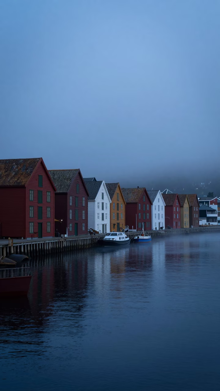 Pre-dawn Bergen Norway Harbor Mist and Historic Bryghan Wharf Architecture in in Bergen, Norway