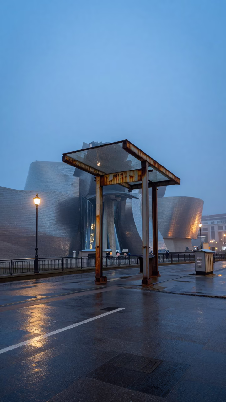 Pre-dawn Bilbao street scene with rusted drawbridge and wet cobblestones in in Bilbao, Spain