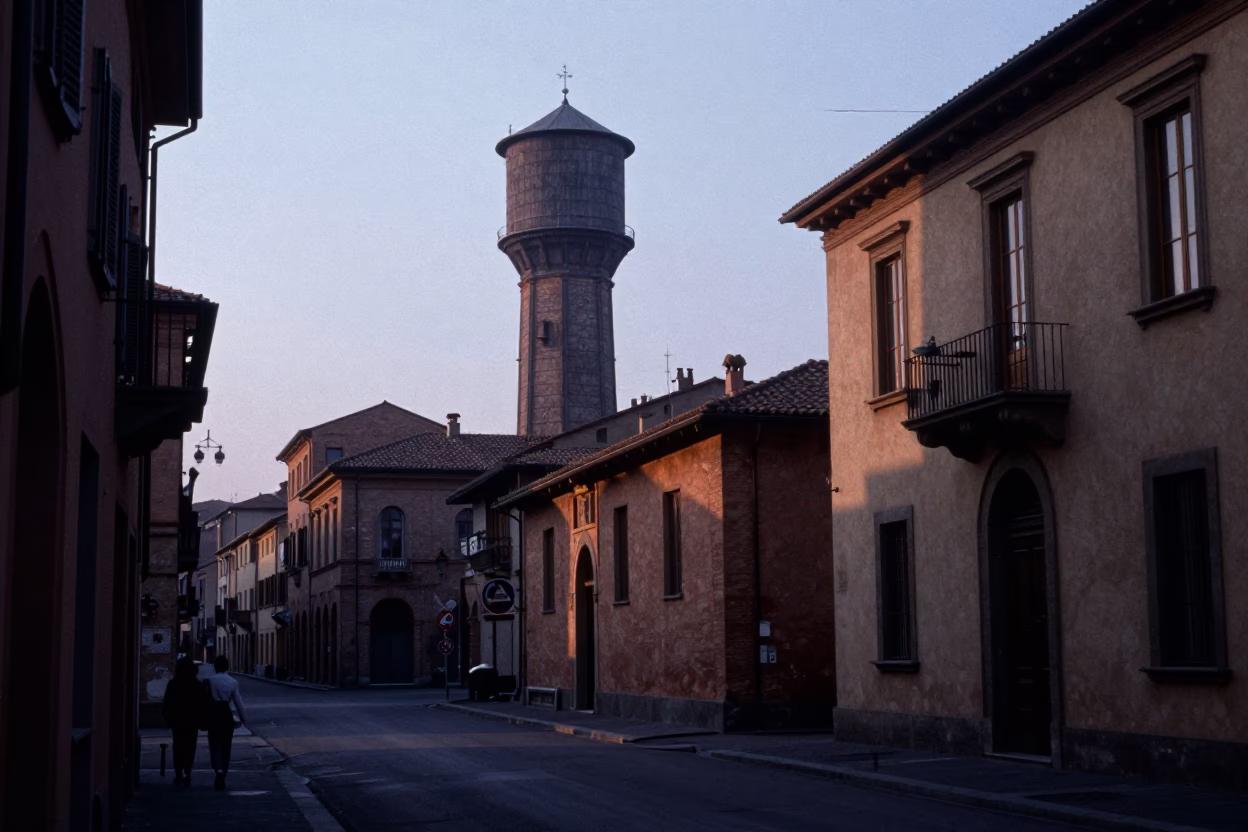 Pre-dawn Bologna street scene with water tower and historic architecture in in Bologna, Italy