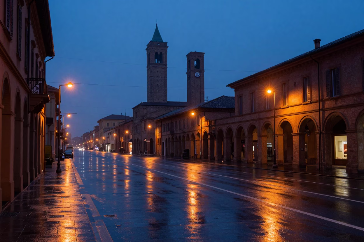 Pre-dawn Bologna street scene with wet asphalt and distant tram lights in in Bologna, Italy
