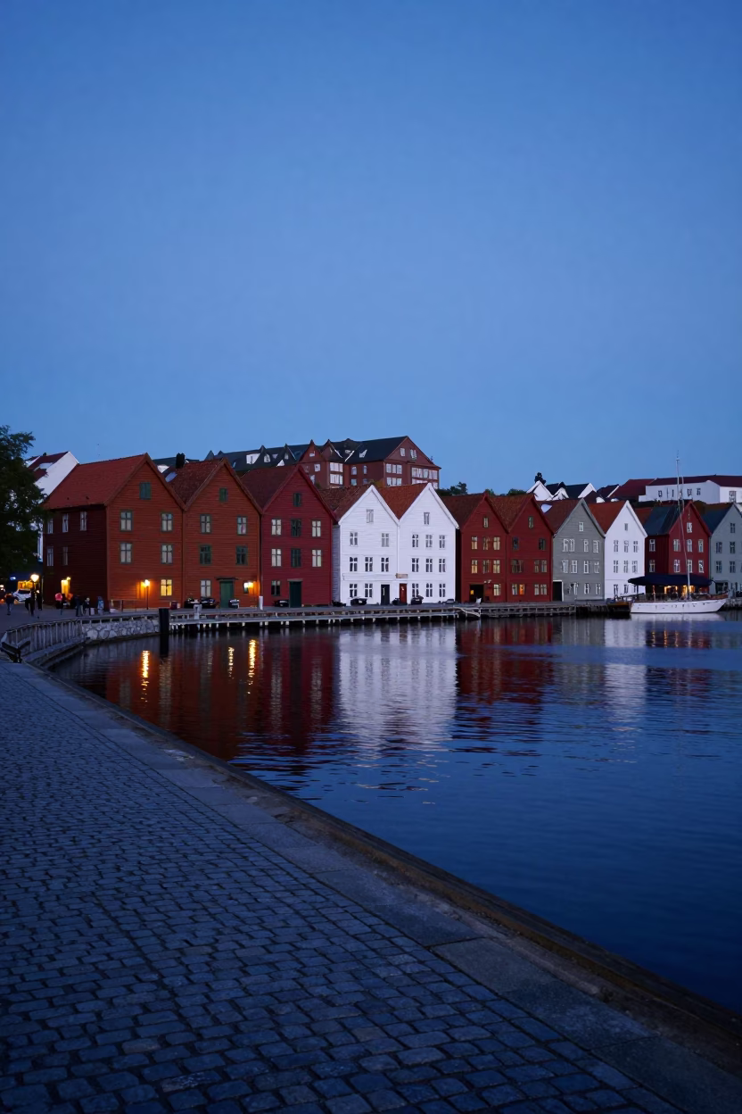 Pre-dawn Bryggen Wharf in Bergen Norway with Cobblestones and Harbor Water in in Bergen, Norway