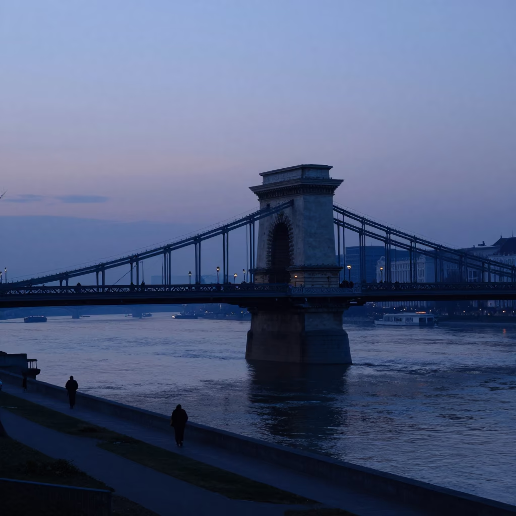 Pre-dawn Budapest Danube Riverbank and Iron Bridge Silhouette at Sunrise in in Budapest, Hungary