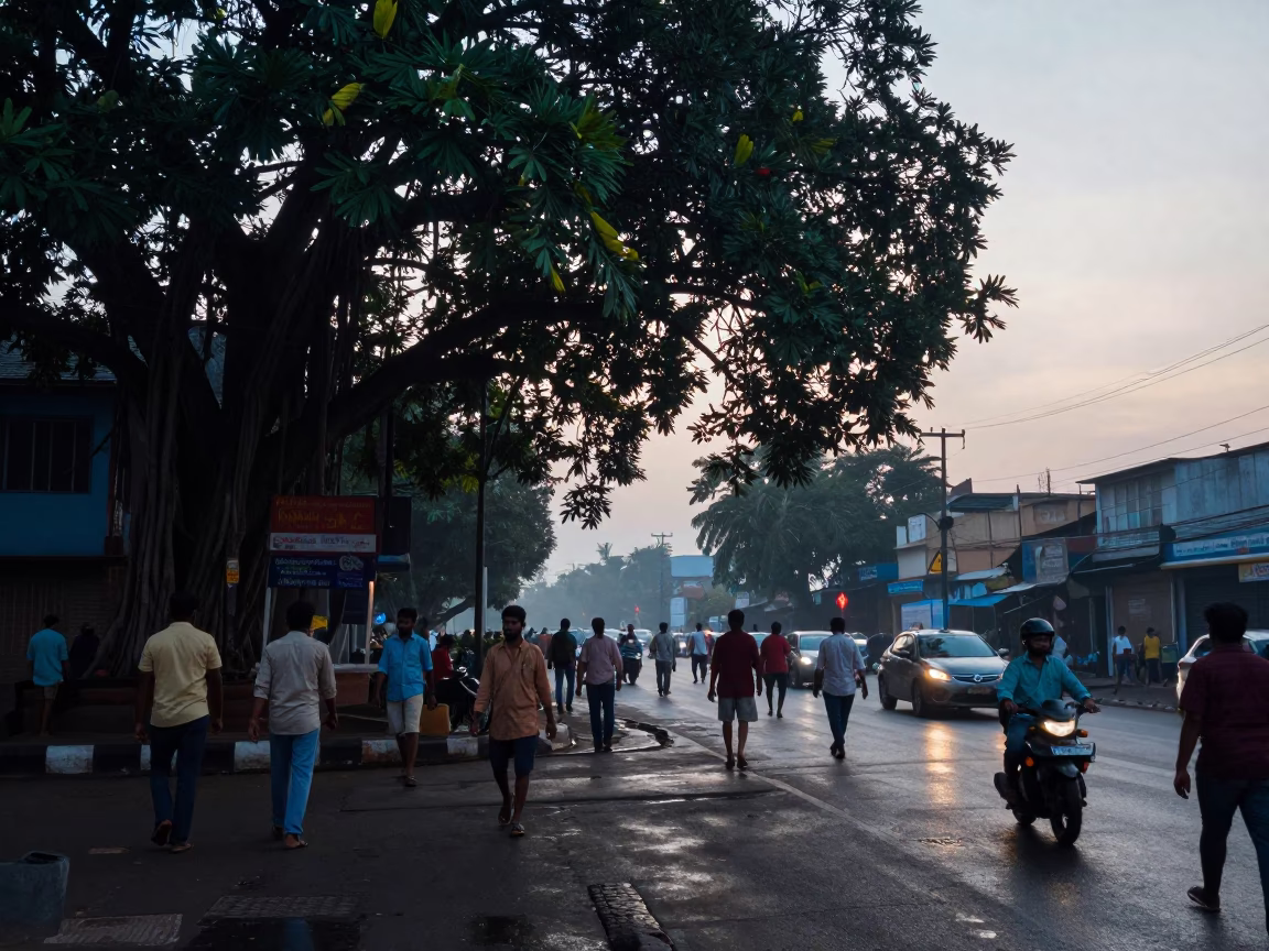 Pre-dawn Chennai Street Scene with Banyan Grove and Morning Commuters in in Chennai, India