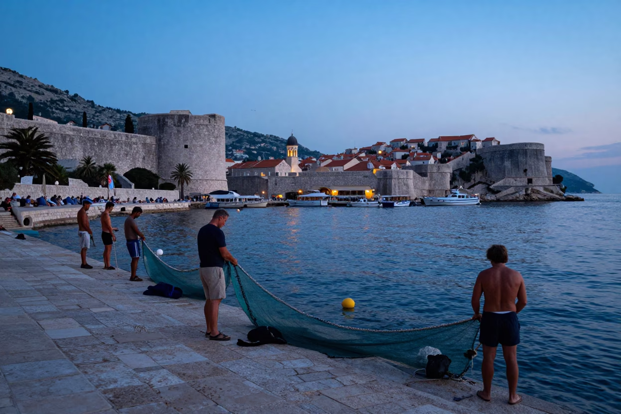 Pre-Dawn Dubrovnik Harbor Scene with Local Fishermen Preparing Nets and Gear in in Dubrovnik, Croatia